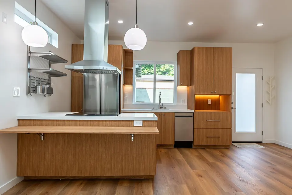 New ADU kitchen with walnut-tone cabinetry
